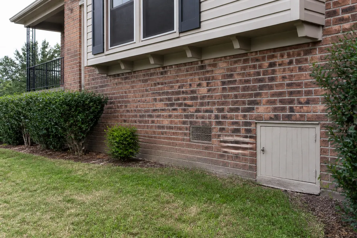Illustrative raised foundation with crawlspace access and a ventilation grille