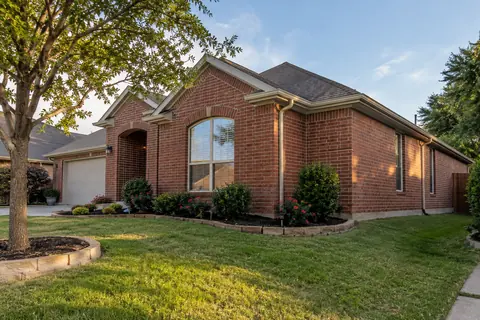 Brick North Texas home with a low exposed concrete slab edge