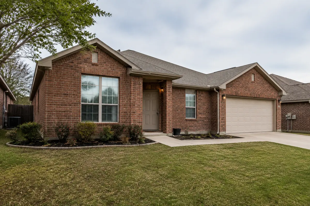 Brick home with a low exposed concrete foundation edge, illustrative image