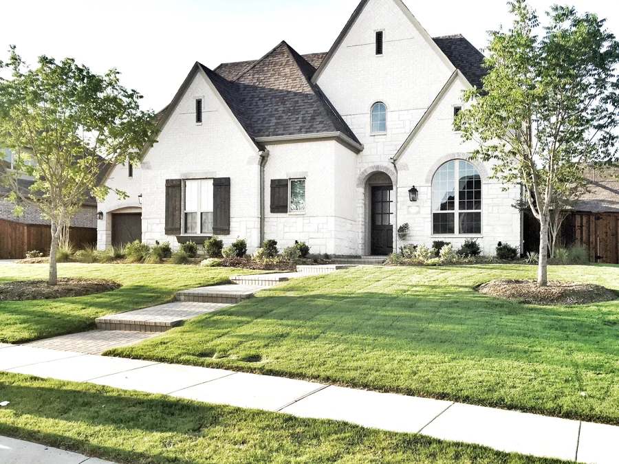 Brick home and surrounding landscaping in North Texas